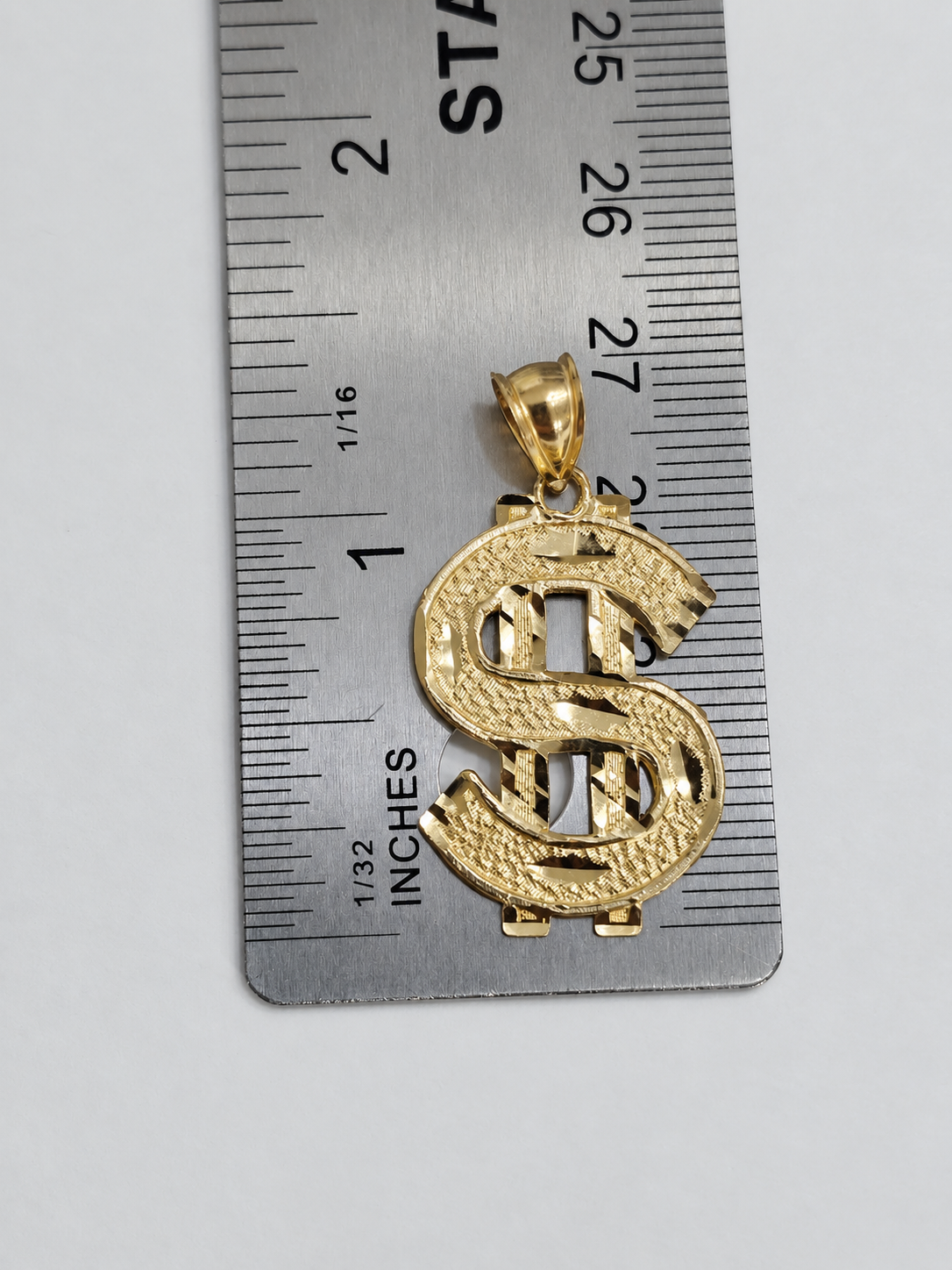 Signo de dólar en oro 10K