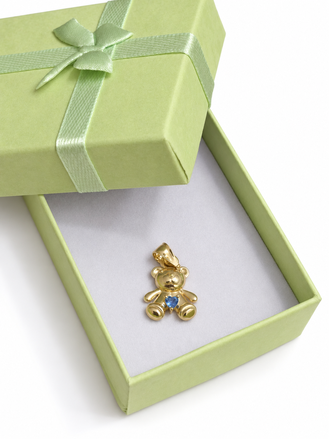 Osito con corazón azul en oro 10K