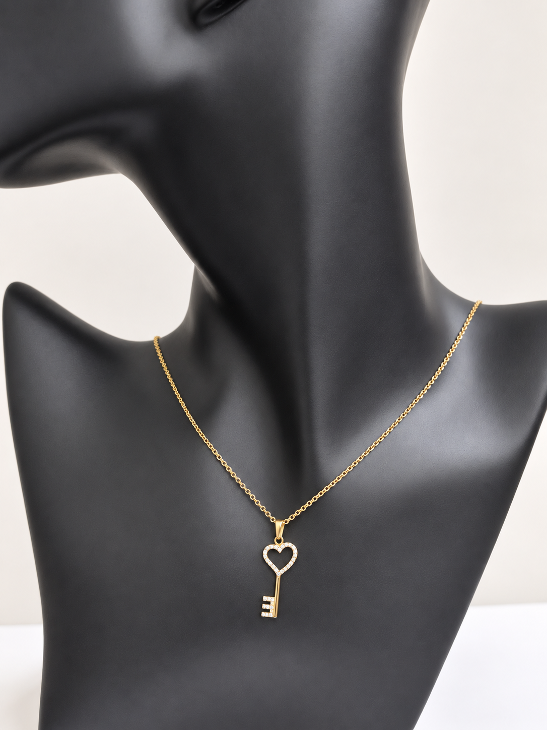 Cadena cable con llave de corazon y circonias en 10k